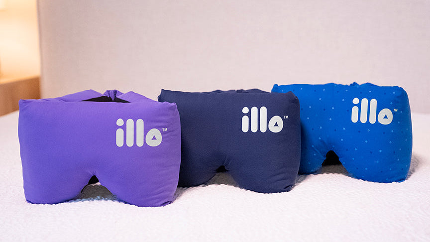 Three sleep masks in purple, blue, and navy with 'illo' branding on a white surface.